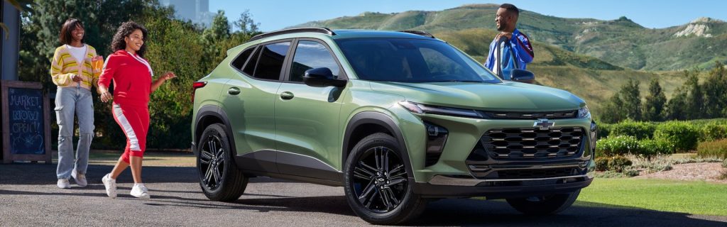 Three people getting into a 2025 Chevy Trax 