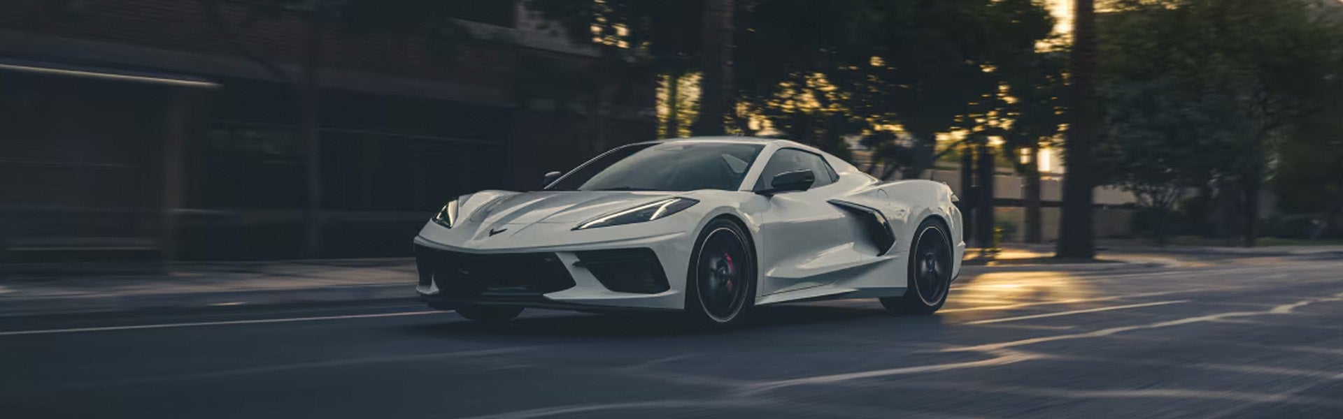 A 2026 Chevrolet Corvette Stingray in motion, showcasing its sleek design and dynamic performance on the road.