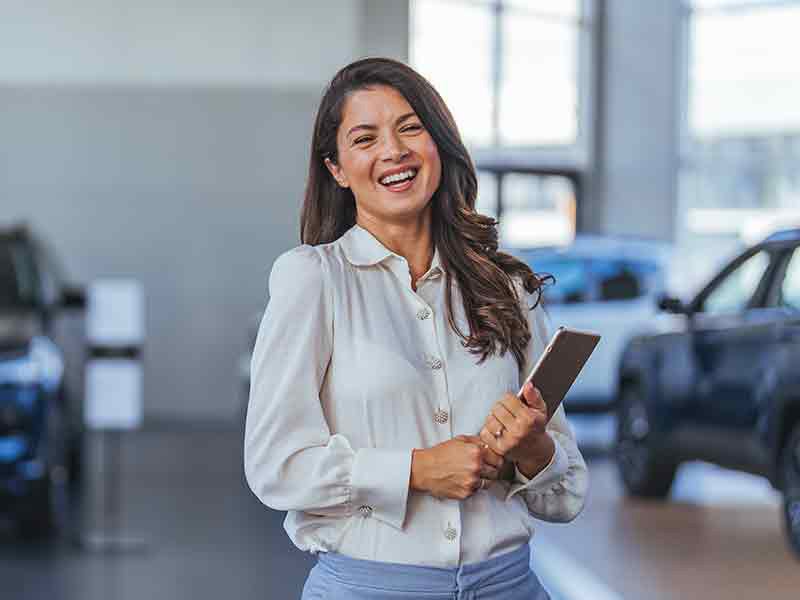 AutoNation Chevrolet Greenacres in Greenacres FL sales rep holding clipboard