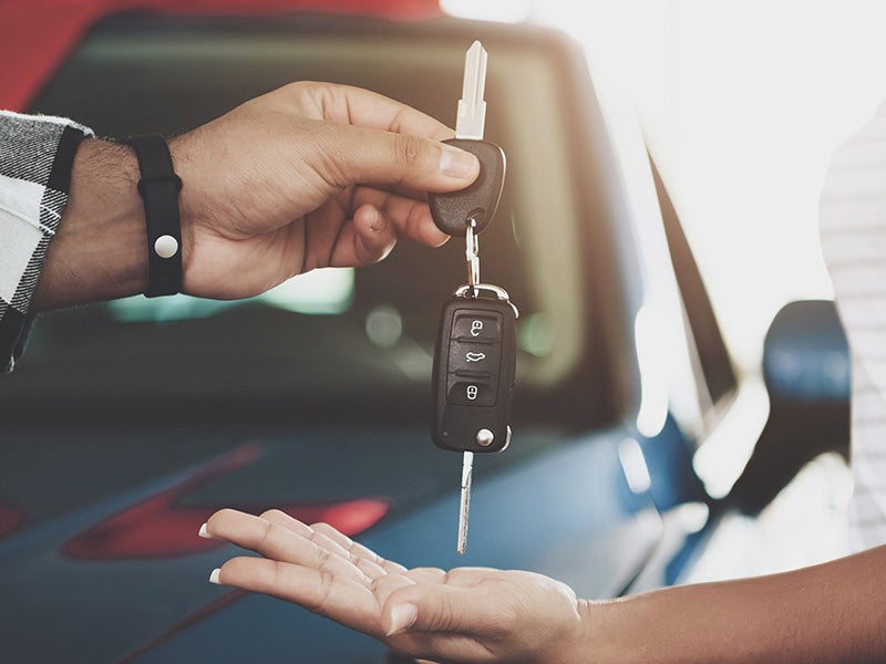 AutoNation Chevrolet Greenacres in Greenacres FL customer being handed keys to a used car
